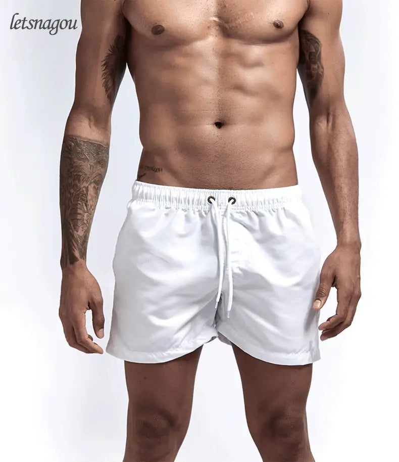 Swim trunks for men - quick dry board shorts with pockets for surfing and beach