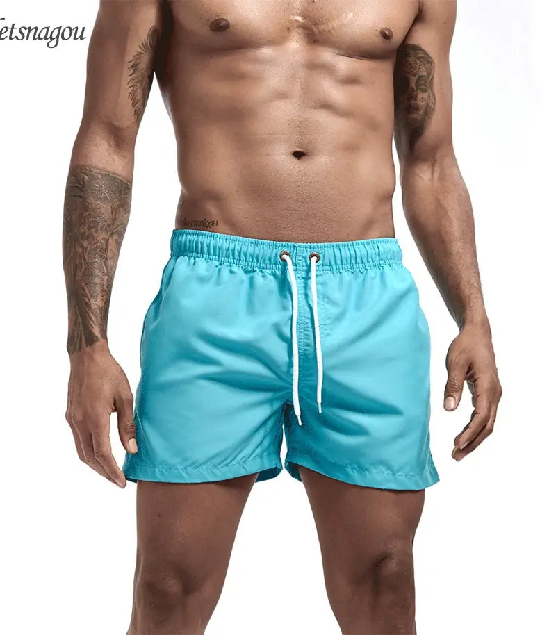 Swim trunks for men - quick dry board shorts with pockets for surfing and beach